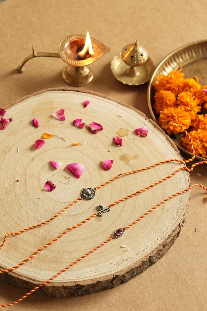 silver rakhi set 