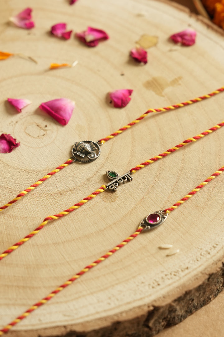silver rakhi set 