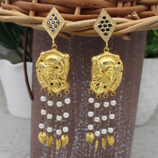 Gold tone silver earrings in peacock design